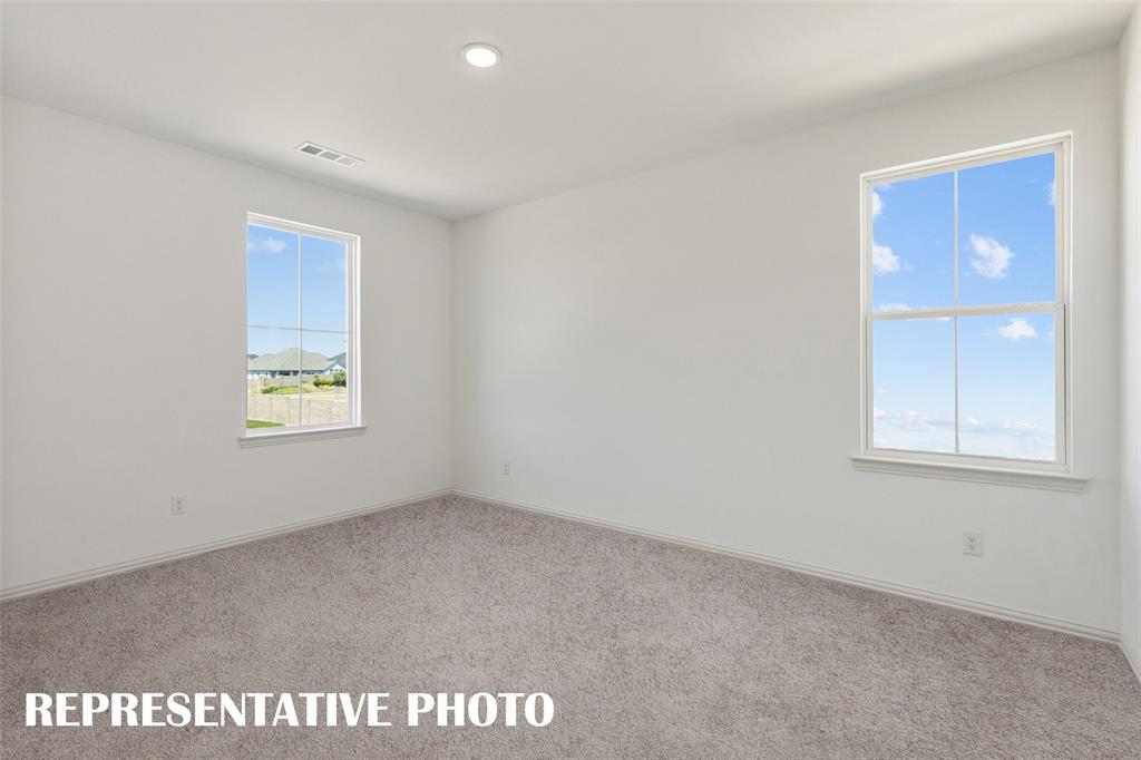 1034 Splitrock Drive Allen, TX 75013 - Photo 14 of 18 an empty room with windows