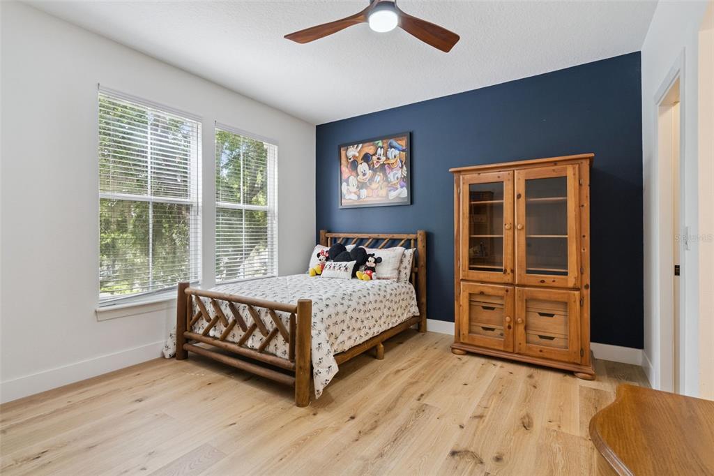 908 Croton Road Celebration, FL 34747 - Photo 38 of 86 a bed room with a bed and a window