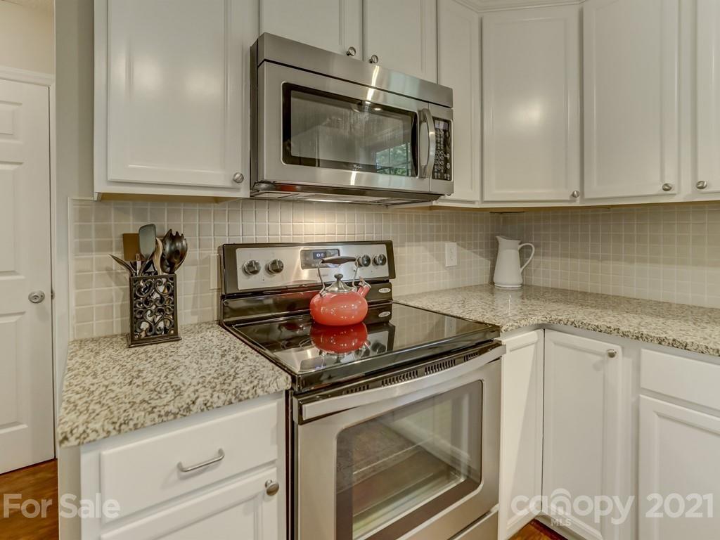 1520 Cobblestone Court Fort Mill, SC 29708 - Photo 12 of 47 a kitchen with appliances cabinets and a counter top space