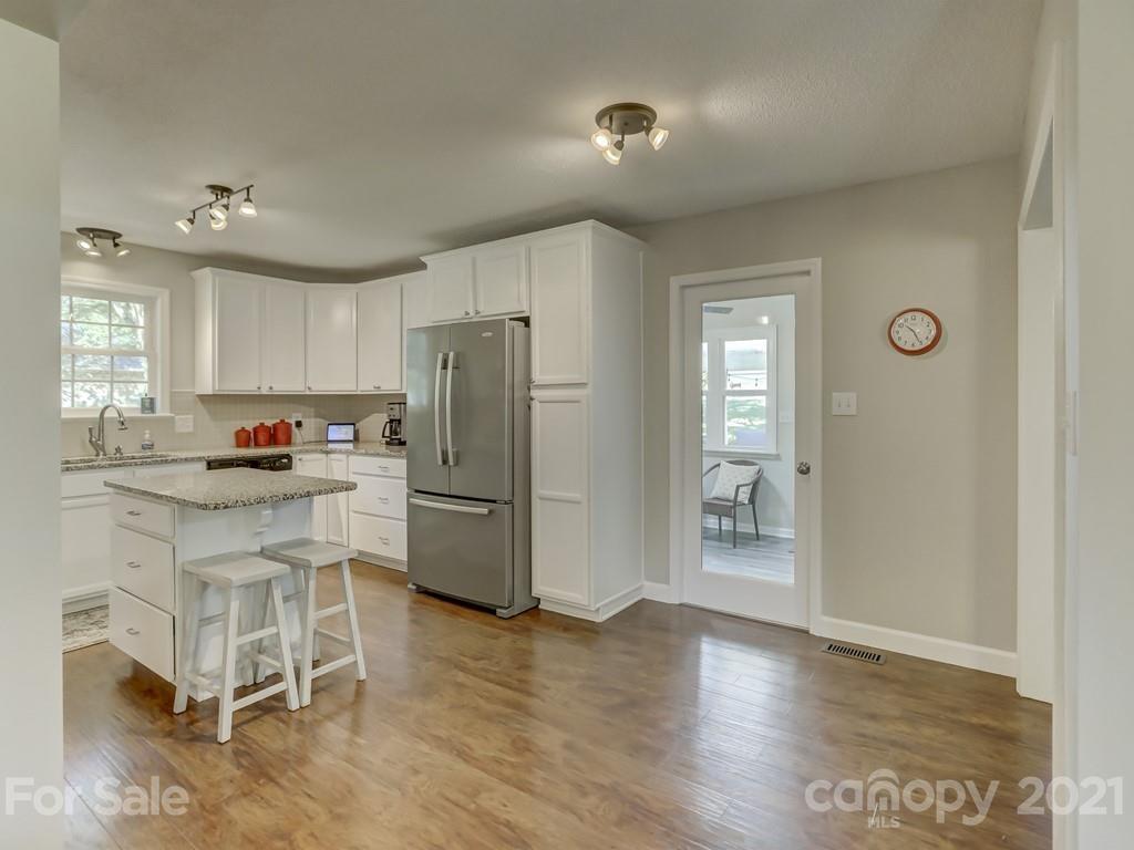 1520 Cobblestone Court Fort Mill, SC 29708 - Photo 13 of 47 a kitchen with a refrigerator a microwave and cabinets