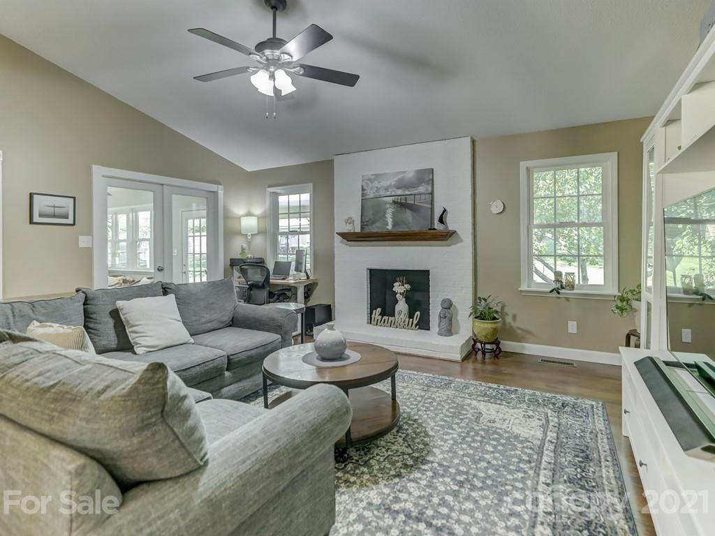 1520 Cobblestone Court Fort Mill, SC 29708 - Photo 14 of 47 a living room with furniture and a fireplace
