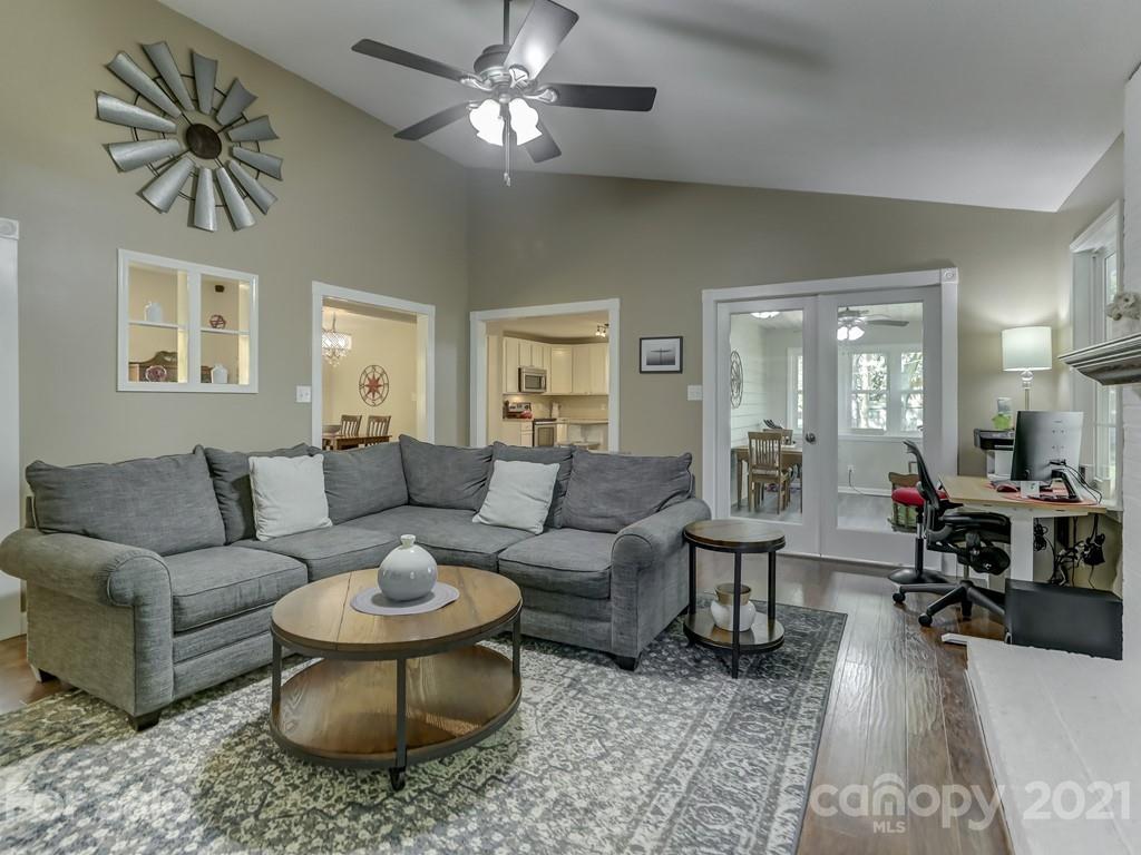 1520 Cobblestone Court Fort Mill, SC 29708 - Photo 15 of 47 a living room with furniture a chandelier and a rug