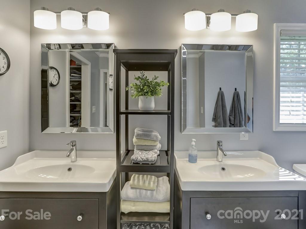 1520 Cobblestone Court Fort Mill, SC 29708 - Photo 23 of 47 a bathroom with a sink and a mirror