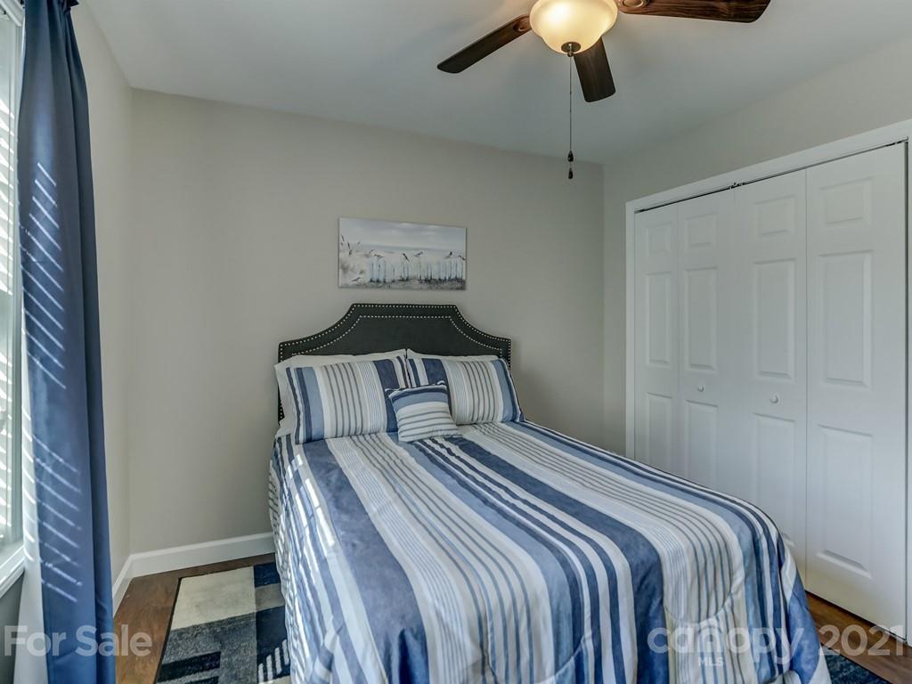 1520 Cobblestone Court Fort Mill, SC 29708 - Photo 27 of 47 a bedroom with a bed and a lamp