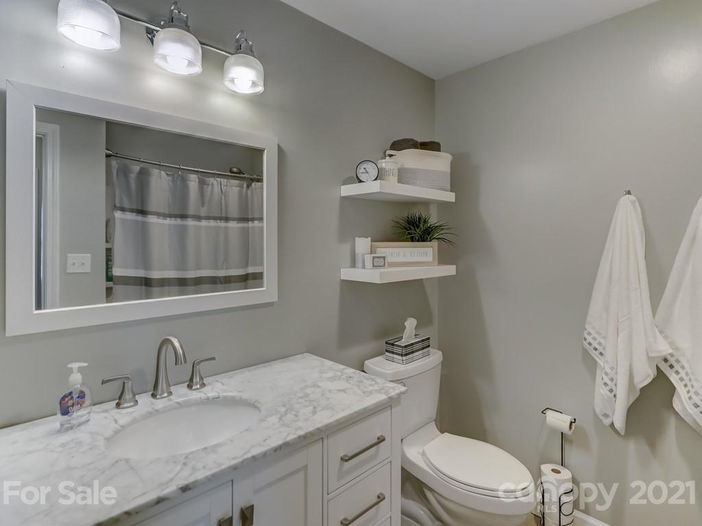 1520 Cobblestone Court Fort Mill, SC 29708 - Photo 29 of 47 a bathroom with a granite countertop toilet sink and mirror