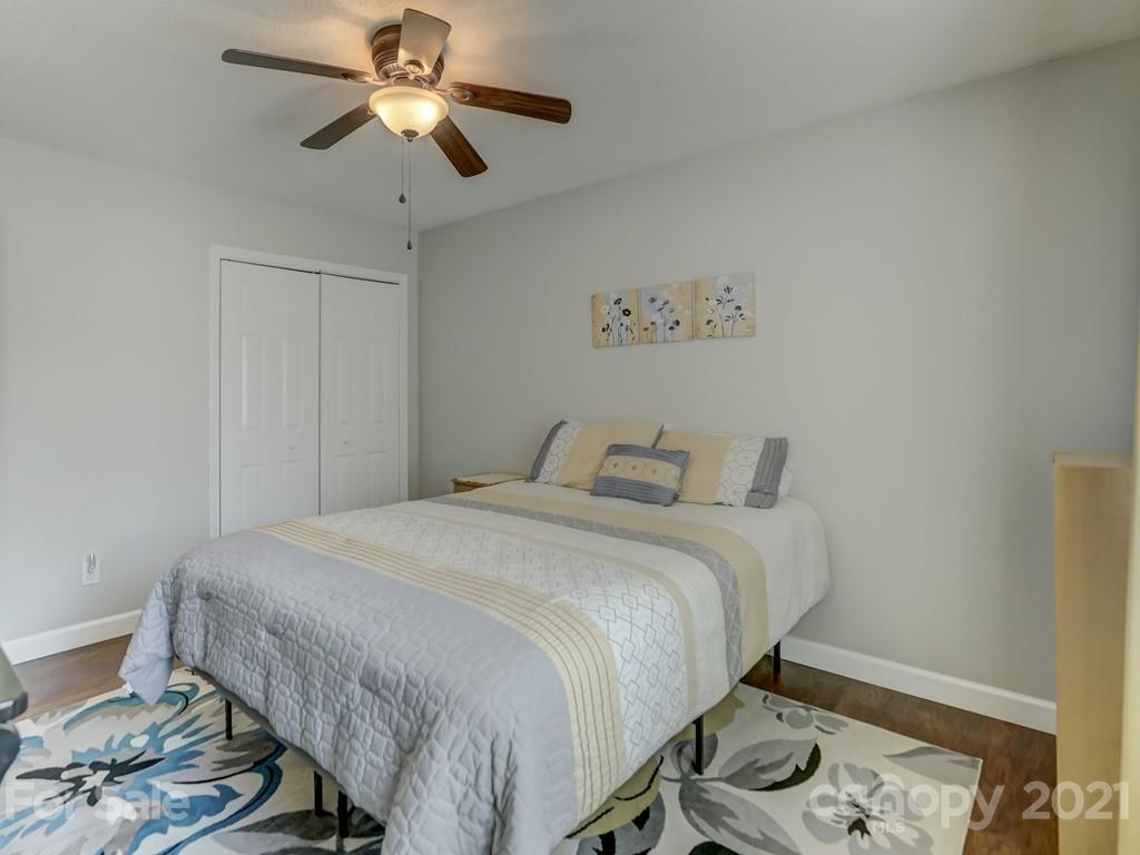 1520 Cobblestone Court Fort Mill, SC 29708 - Photo 30 of 47 a bedroom with a bed and a chandelier