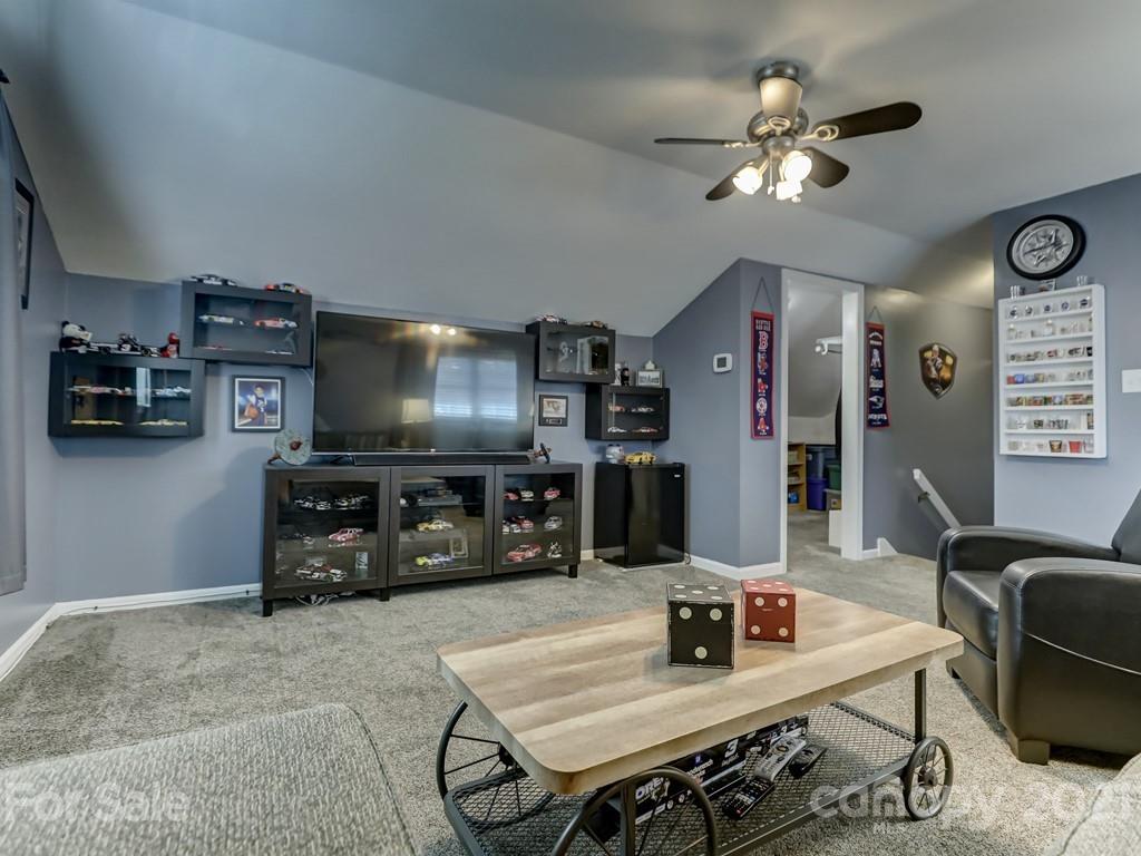 1520 Cobblestone Court Fort Mill, SC 29708 - Photo 35 of 47 a living room with furniture and a flat screen tv