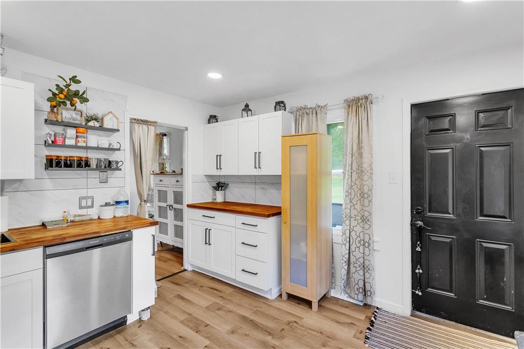 1747 Galilee Road Wampum, PA 16157 - Photo 5 of 32 The kitchen’s contemporary upgrades blend seamlessly with the home’s inviting atmosphere.