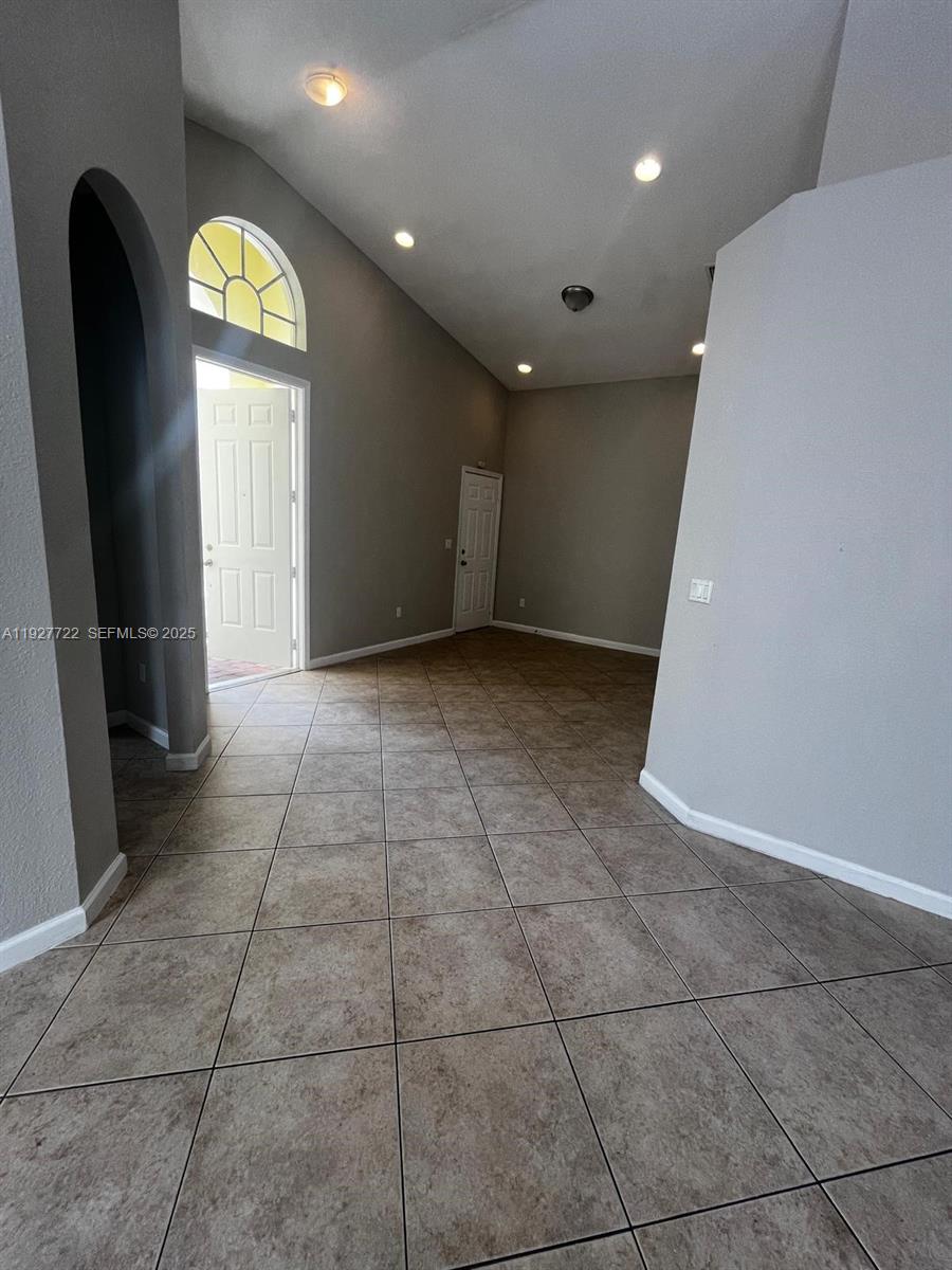 2219 Portofino Avenue Homestead, FL 33033 - Photo 3 of 9 a view of an empty room with a window