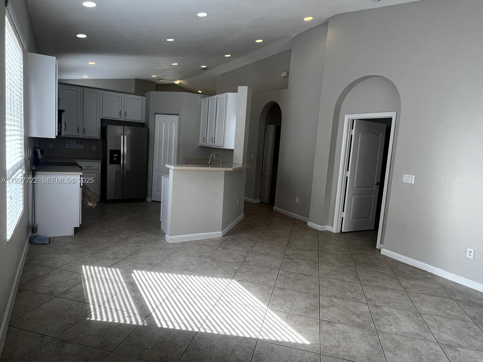 2219 Portofino Avenue Homestead, FL 33033 - Photo 4 of 9 a kitchen with refrigerator and cabinets