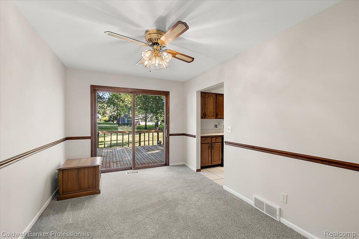 78 Carter Avenue Troy, MI 48098 - Photo 11 of 52 Empty room featuring light colored carpet and ceiling fan