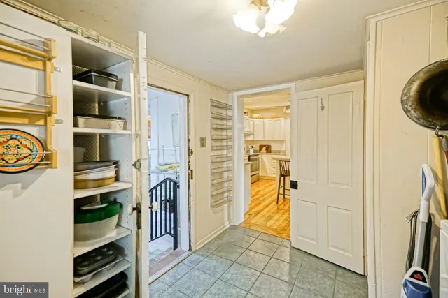 a bedroom with furniture and a potted plant