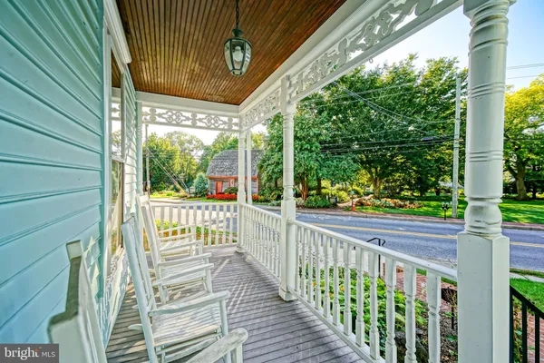 a view of a porch with wooden floor
