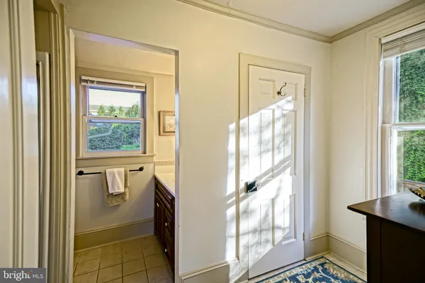 a bedroom with a bed and a dresser in it