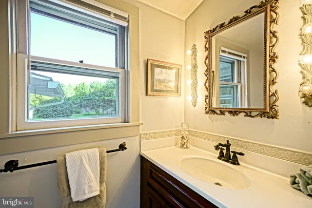 a bedroom with furniture and a wooden floor