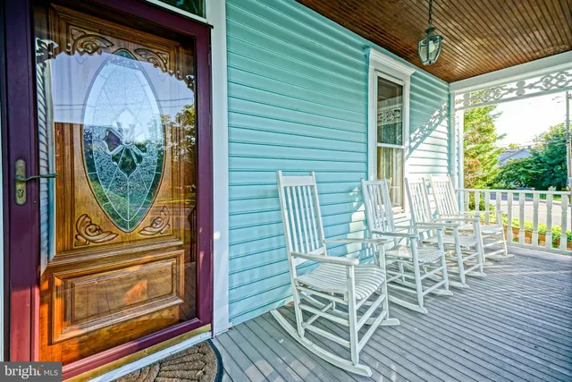 a view of a two chairs in the balcony