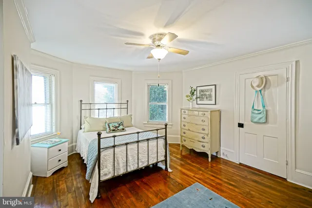 a view of a backyard with wooden fence