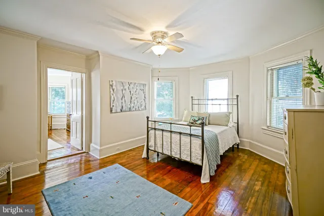 a house view with outdoor seating space and wooden fence