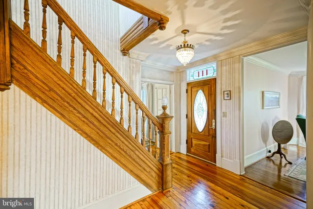 a view of an entryway wooden floor and door