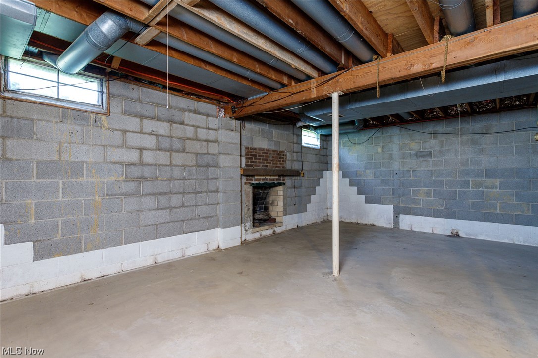 3177 Pickle Road Akron, OH 44312 - Photo 30 of 32 Full basement with fireplace. Imagine all of the possibilities.