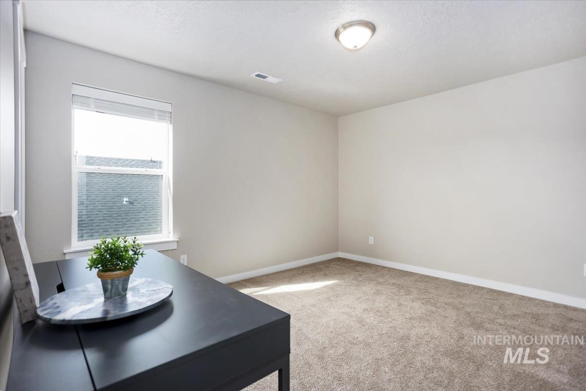 3729 South Maple Ridge Avenue Nampa, ID 83686 - Photo 31 of 46 Office space with light colored carpet and baseboards