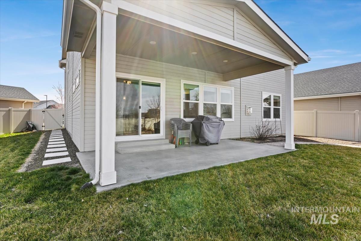 3729 South Maple Ridge Avenue Nampa, ID 83686 - Photo 38 of 46 Rear view of property featuring a gate and a patio area