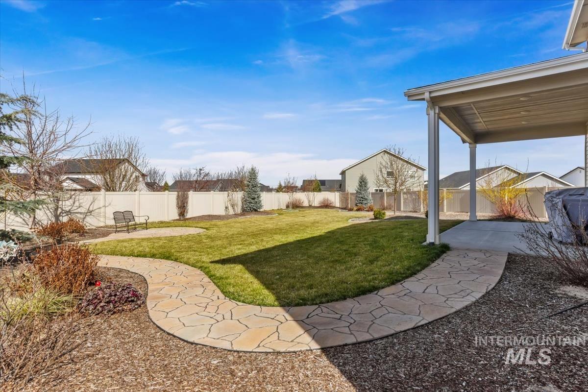 3729 South Maple Ridge Avenue Nampa, ID 83686 - Photo 42 of 46 Fenced backyard featuring a patio area and a residential view