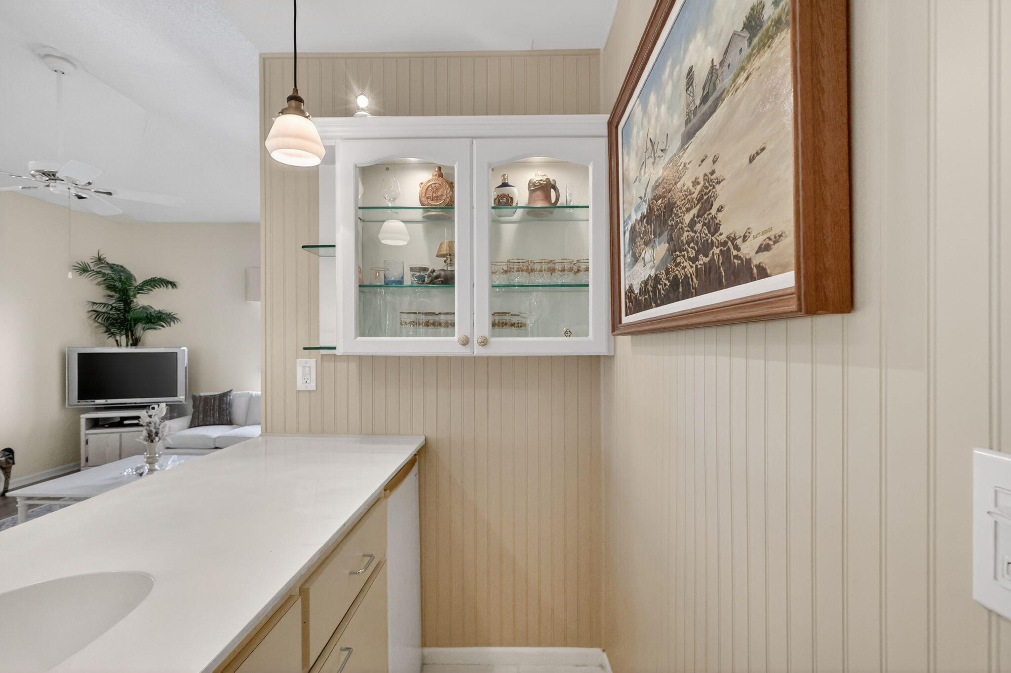 5422 Southeast Meredith Terrace Stuart, FL 34997 - Photo 13 of 56 a kitchen with a sink and a refrigerator