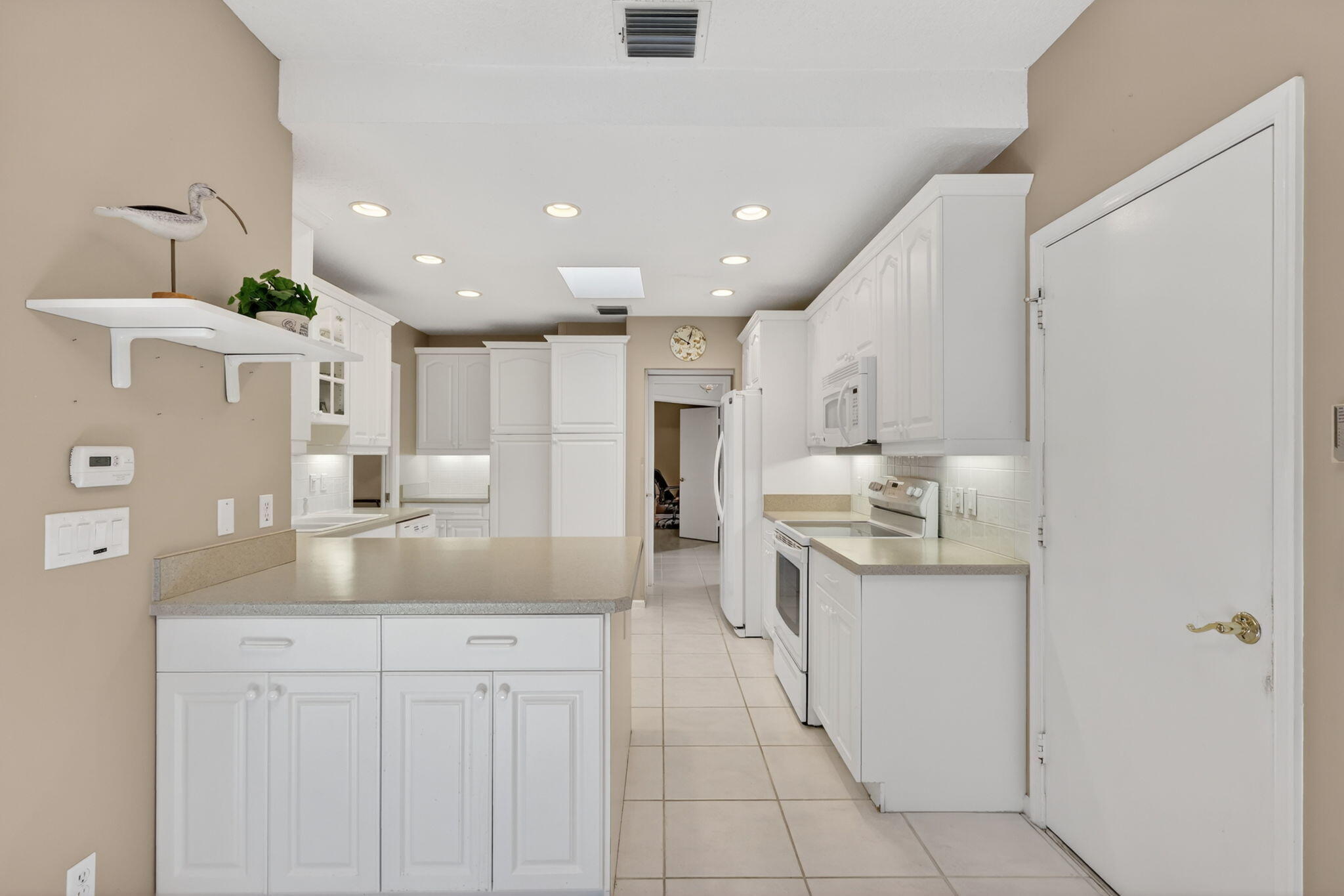 5422 Southeast Meredith Terrace Stuart, FL 34997 - Photo 14 of 56 a kitchen with stainless steel appliances granite countertop a sink and cabinets