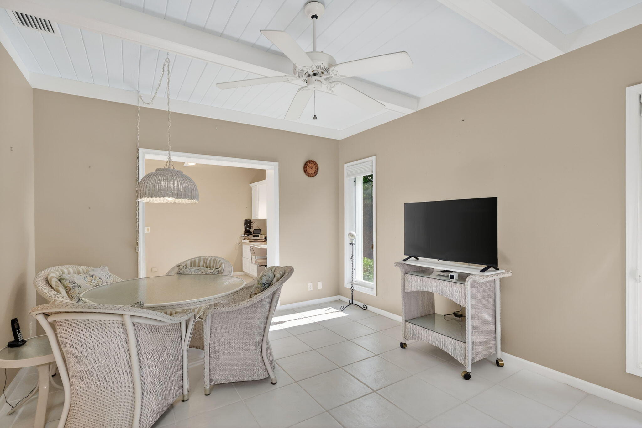 5422 Southeast Meredith Terrace Stuart, FL 34997 - Photo 20 of 56 a living room with furniture and a flat screen tv