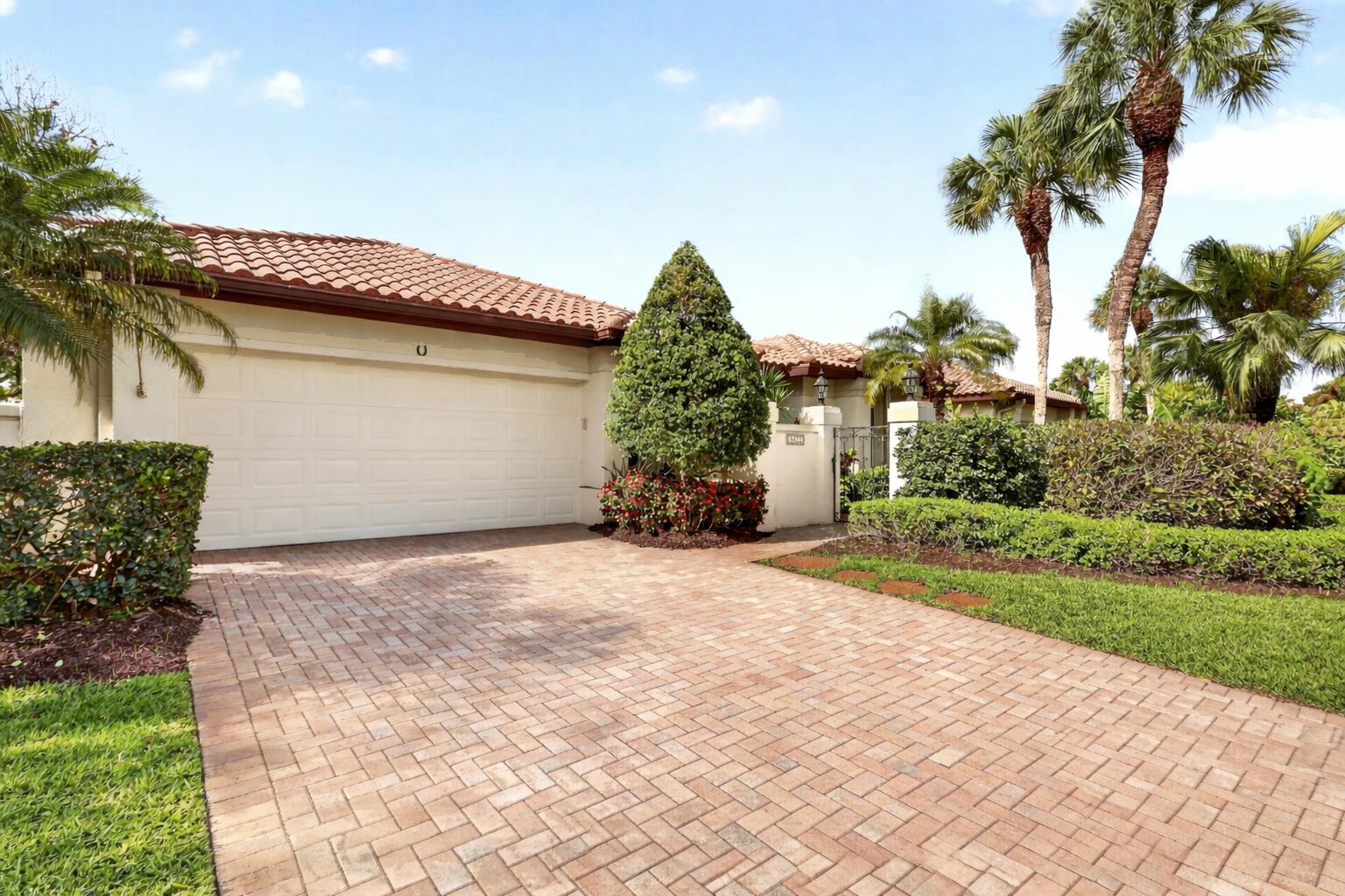 5422 Southeast Meredith Terrace Stuart, FL 34997 - Photo 3 of 56 a front view of a house with a yard and garage
