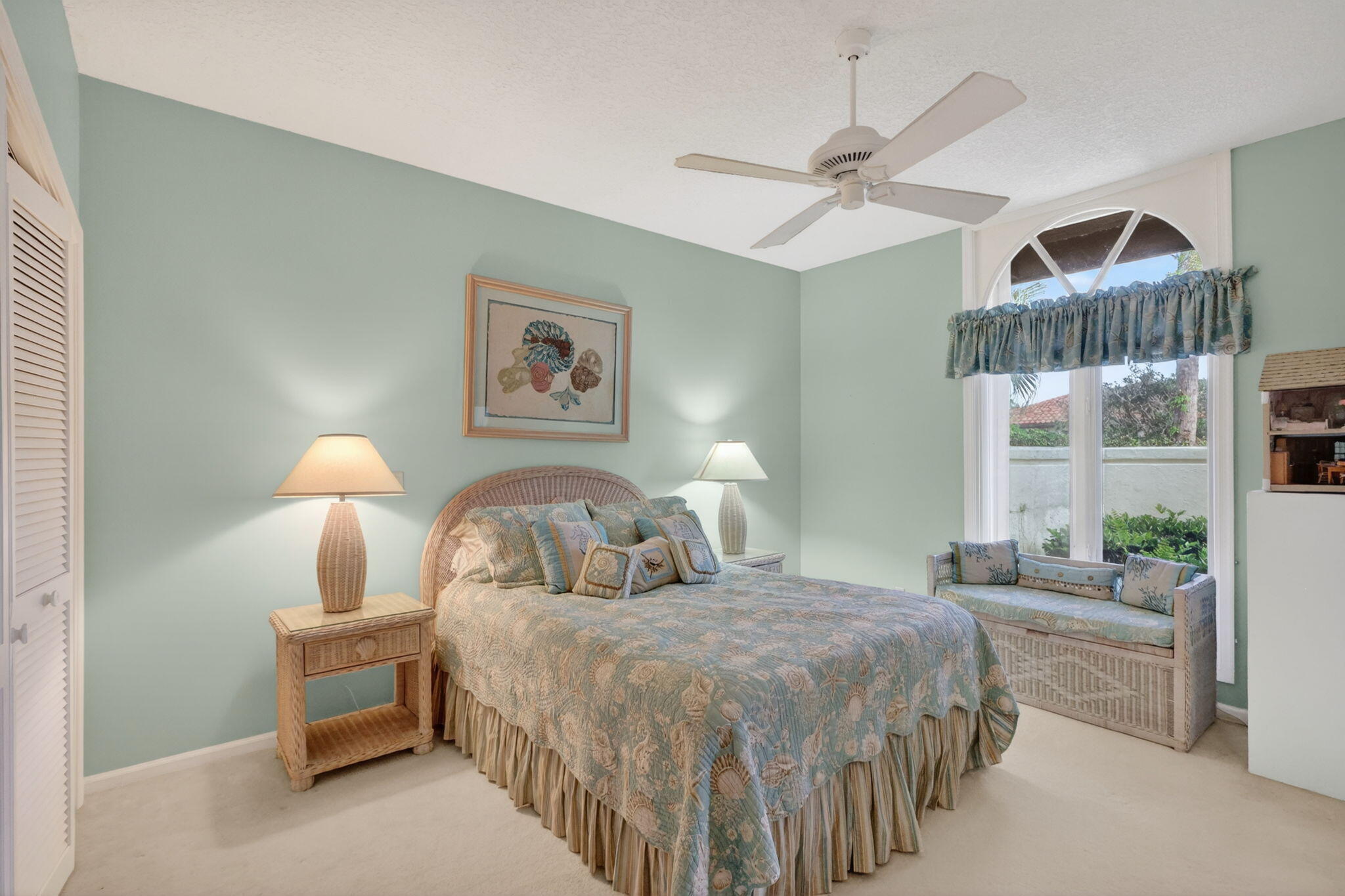 5422 Southeast Meredith Terrace Stuart, FL 34997 - Photo 32 of 56 a bedroom with a bed and a chandelier