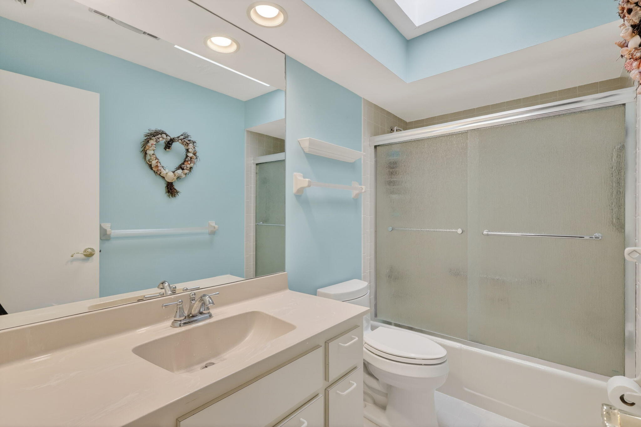 5422 Southeast Meredith Terrace Stuart, FL 34997 - Photo 34 of 56 a bathroom with a sink a toilet and shower