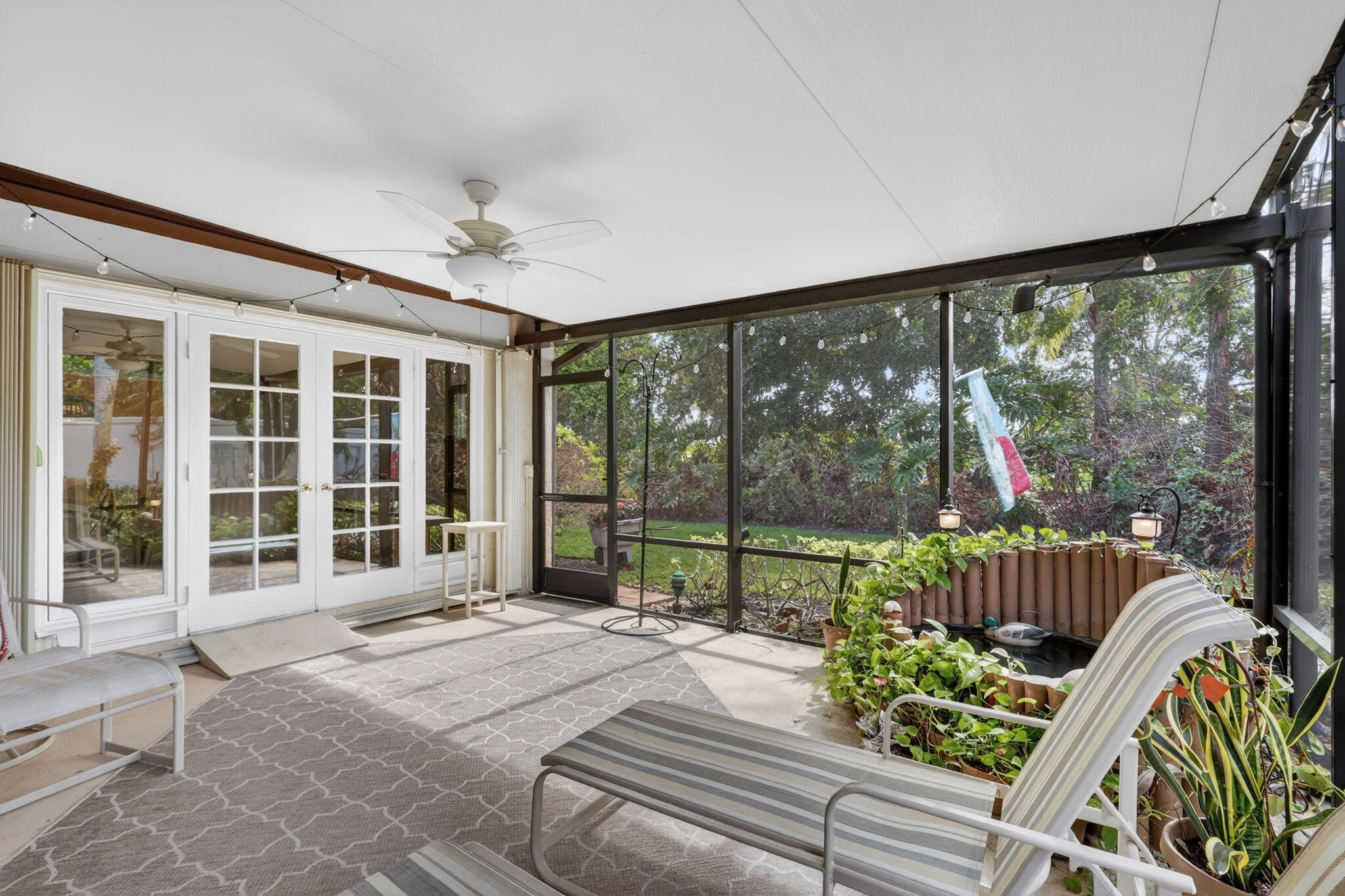 5422 Southeast Meredith Terrace Stuart, FL 34997 - Photo 36 of 56 a living room filled with furniture and a large window