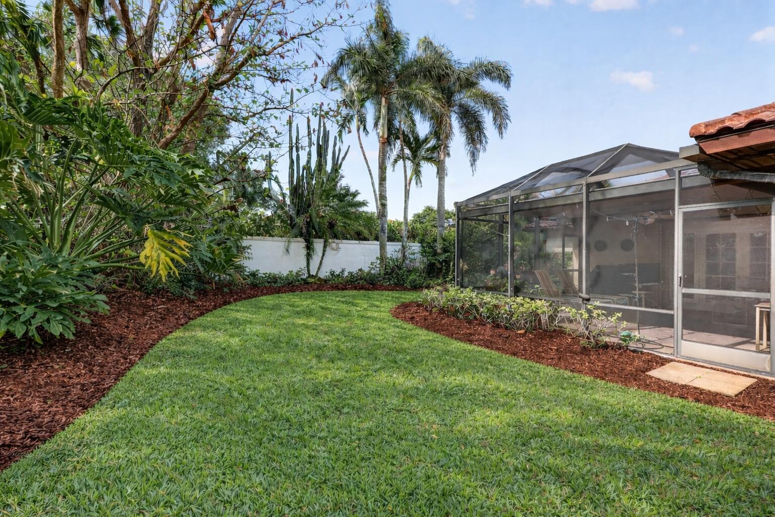 5422 Southeast Meredith Terrace Stuart, FL 34997 - Photo 39 of 56 a view of a backyard with a garden