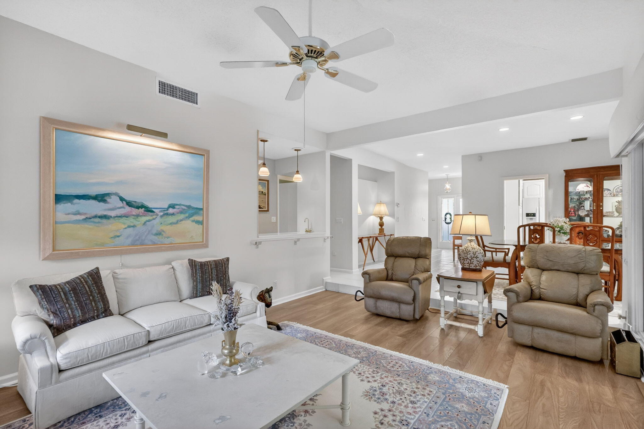 5422 Southeast Meredith Terrace Stuart, FL 34997 - Photo 7 of 56 a living room with furniture and a chandelier