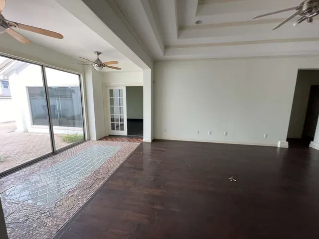 a view of empty room with floor to ceiling window