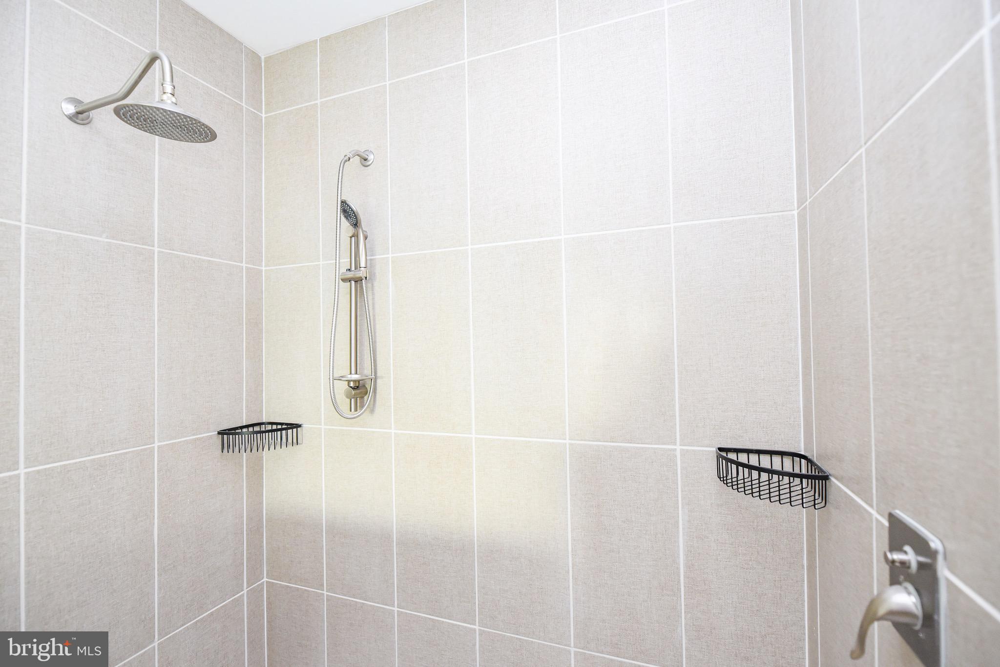 34340 River Road, Unit 129 Long Neck, DE 19966 - Photo 11 of 16 a bathroom with a shower