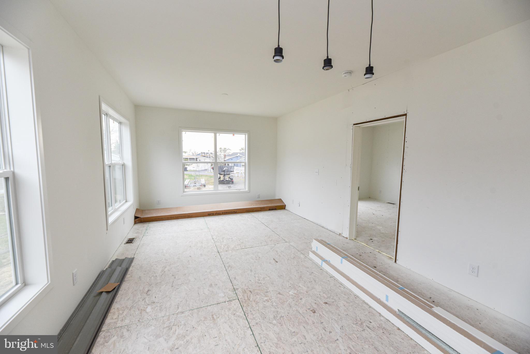 34340 River Road, Unit 129 Long Neck, DE 19966 - Photo 4 of 16 a view of an empty room with a window
