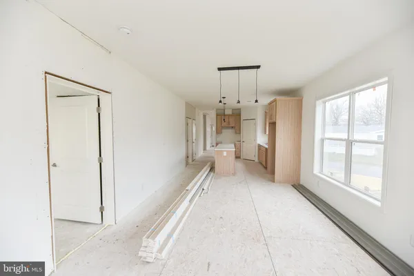 a kitchen with kitchen island cabinets and refrigerator