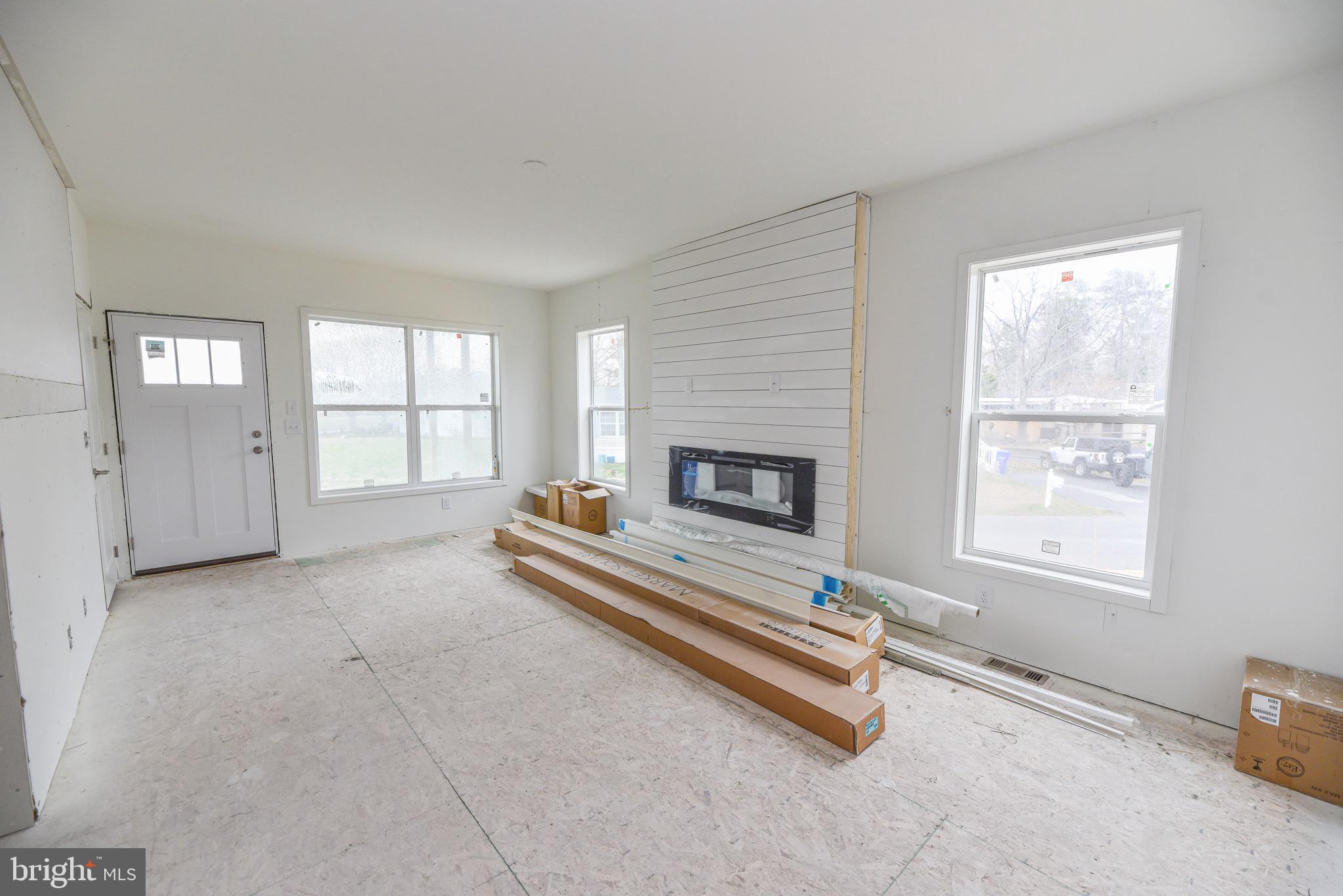 34340 River Road, Unit 129 Long Neck, DE 19966 - Photo 7 of 16 an empty room with windows