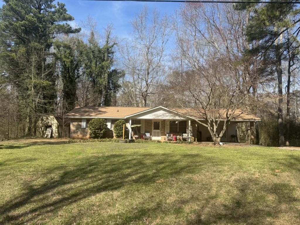 75 Sand Hill Shady Grove Road Carrollton, GA 30116 - Photo 1 of 2 a front view of a house with a yard