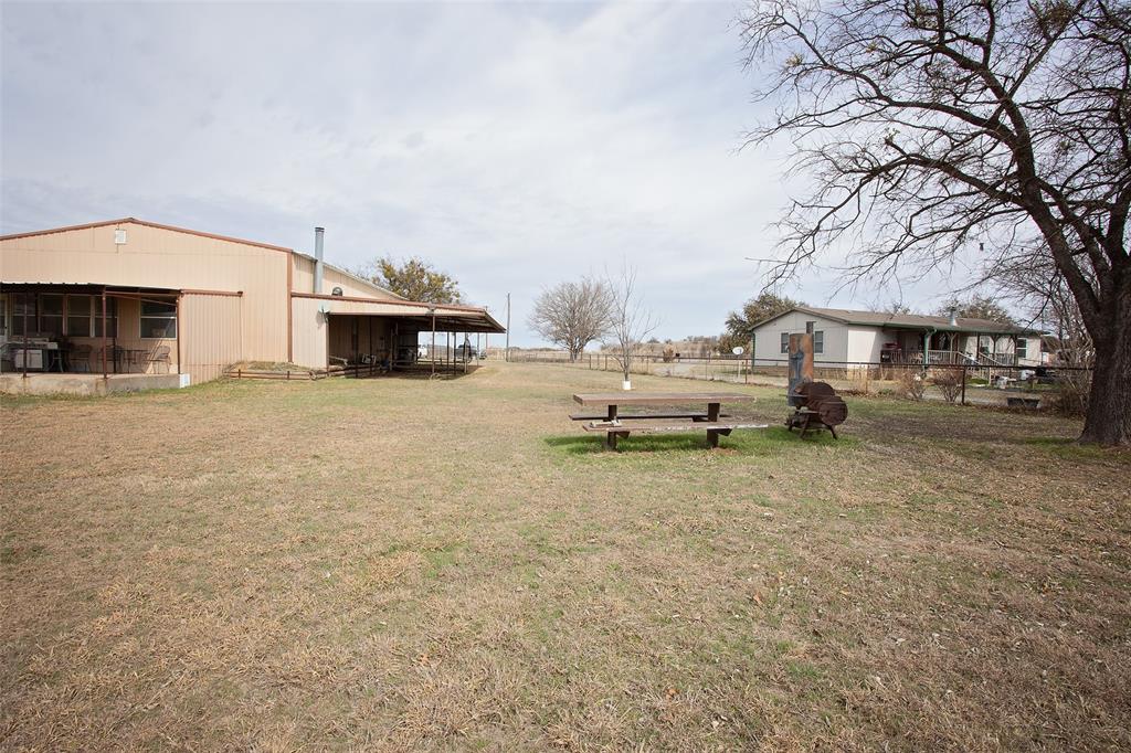 1193 Eastside Lake Road Graham, TX 76450 - Photo 13 of 38 a view of a house with a yard and sitting area