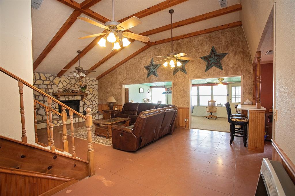 1193 Eastside Lake Road Graham, TX 76450 - Photo 18 of 38 a living room with furniture and a large window