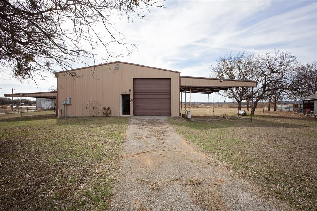 1193 Eastside Lake Road Graham, TX 76450 - Photo 2 of 38 a house view with a backyard space