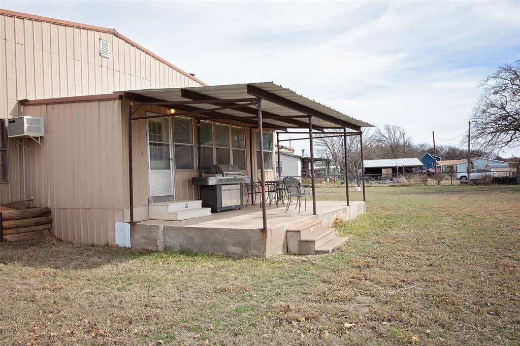1193 Eastside Lake Road Graham, TX 76450 - Photo 5 of 38 a view of a house with a outdoor space