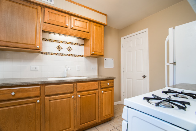 263-265 Chicago Road Oswego, IL 60543 - Photo 12 of 25 a room with storage and utility