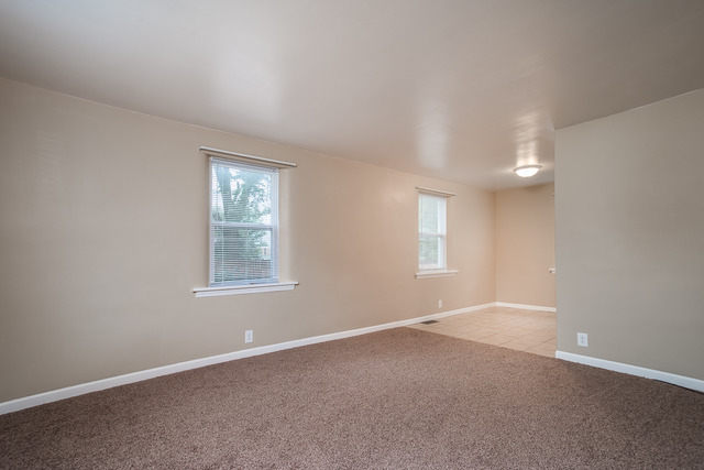 263-265 Chicago Road Oswego, IL 60543 - Photo 13 of 25 an empty room with windows