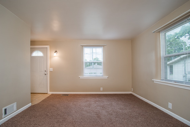 263-265 Chicago Road Oswego, IL 60543 - Photo 14 of 25 an empty room with a window