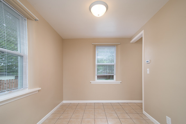 263-265 Chicago Road Oswego, IL 60543 - Photo 16 of 25 an empty room with windows